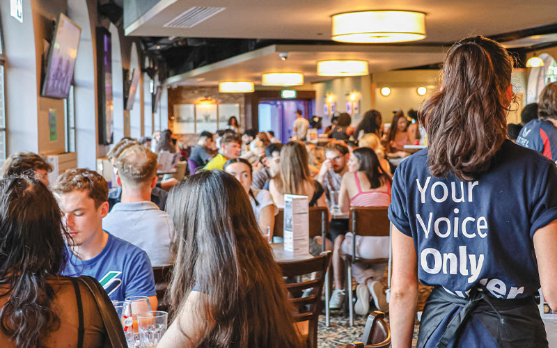 a photo of student staff working in joe's bar