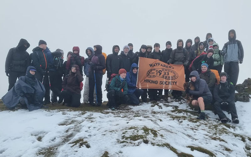 a photo of students climbing a mountain
