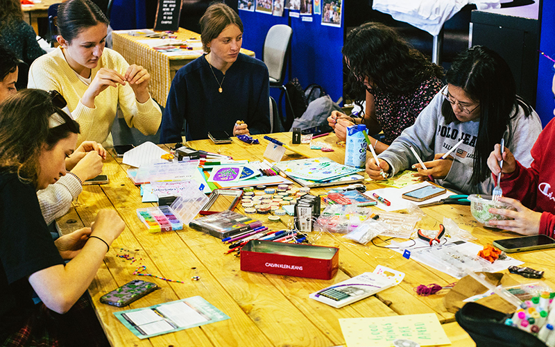 a photo of a group of students doing crafts