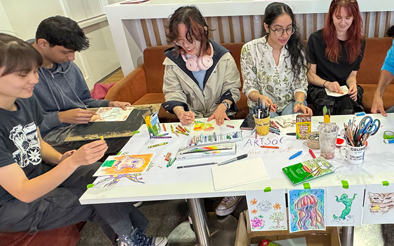 a photo of students at a crafts event