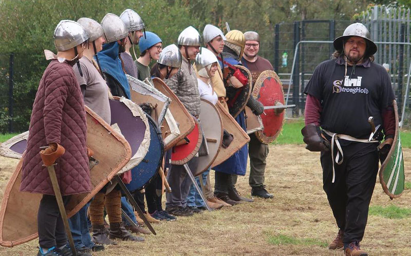 a photo of students at a battle reenactment event