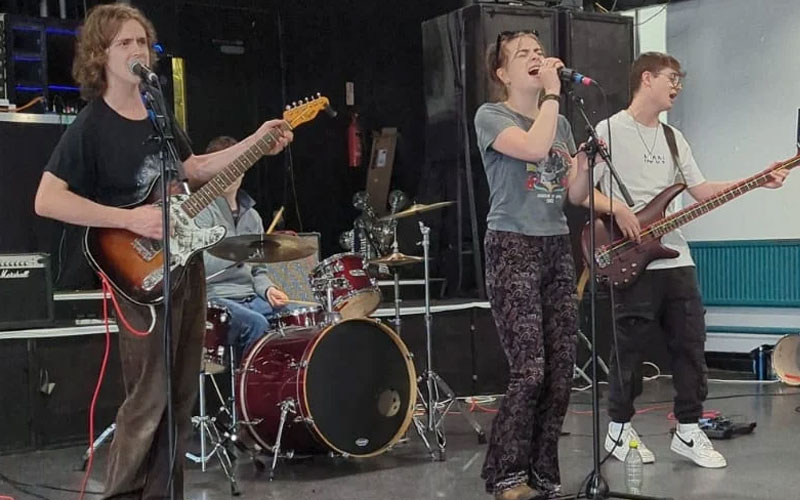 a photo of a group of students in a band