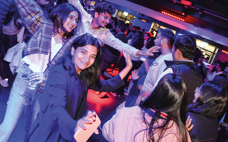 a photo of a students dancing at an event