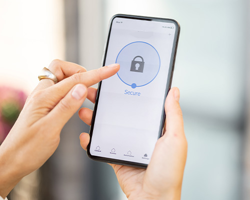 an image of a person using a mobile with the word safety on the mobile