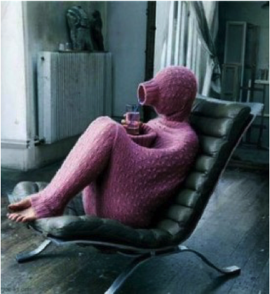 person in a pink onsie on a leather chair