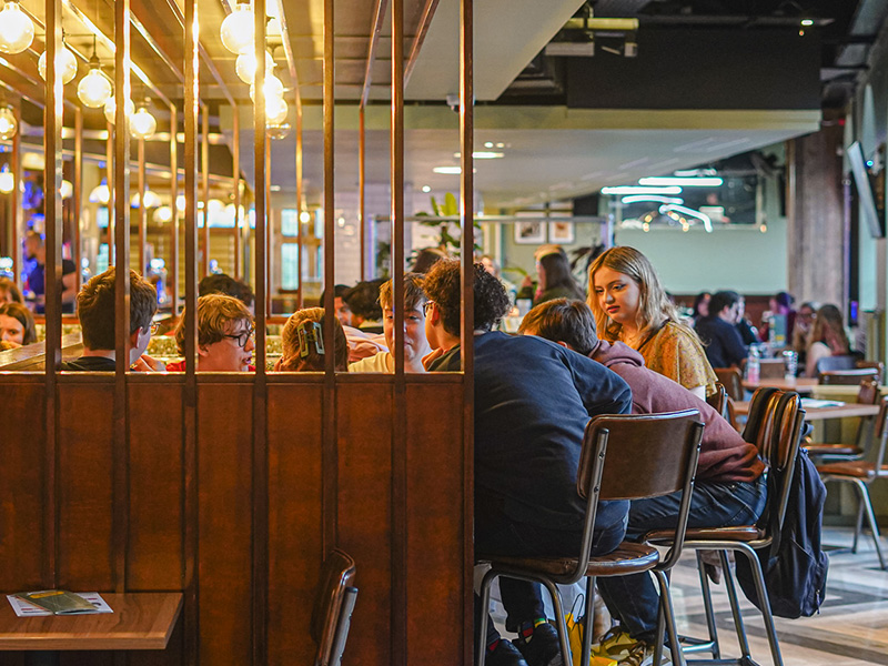 an image of the students sat at tables