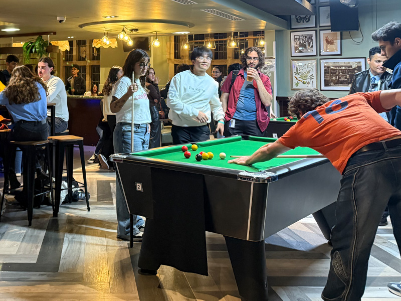 an image of the students playing pool