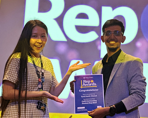 a student receiving an award at rep awards