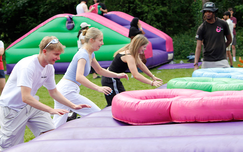 students on inflatables