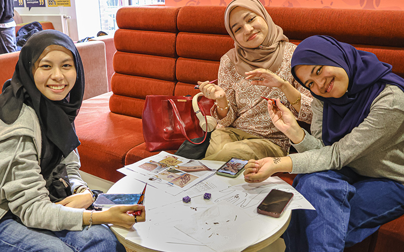 students sat down at a crafts event