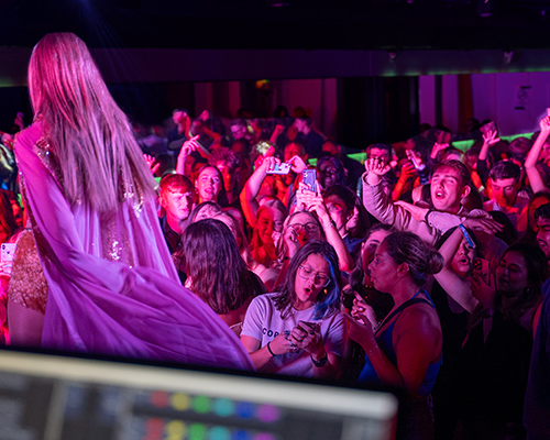 a singer at an event in the underground at the guild