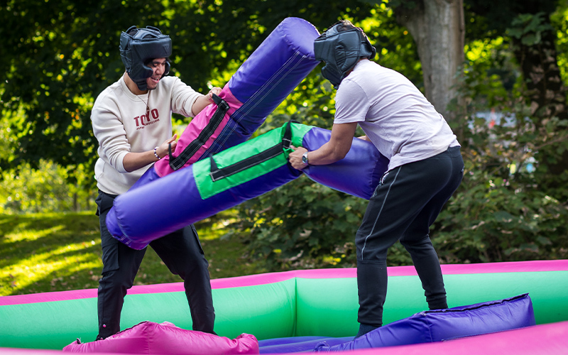 students on inflatables at a guild event
