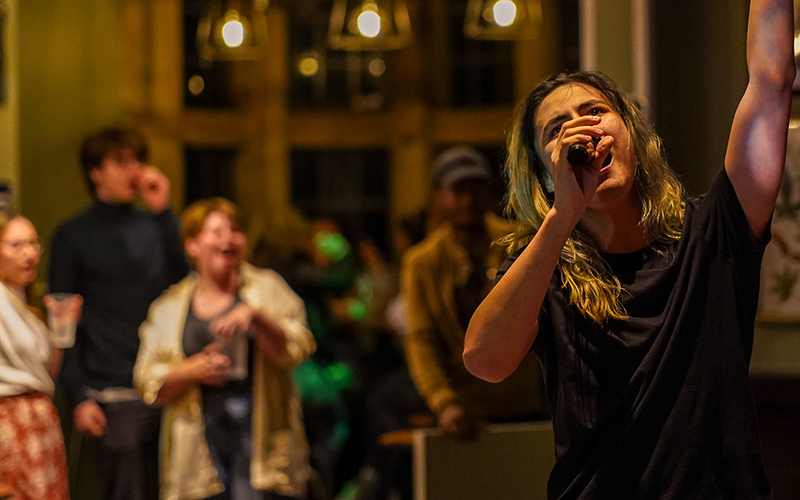 a student singing on karaoke