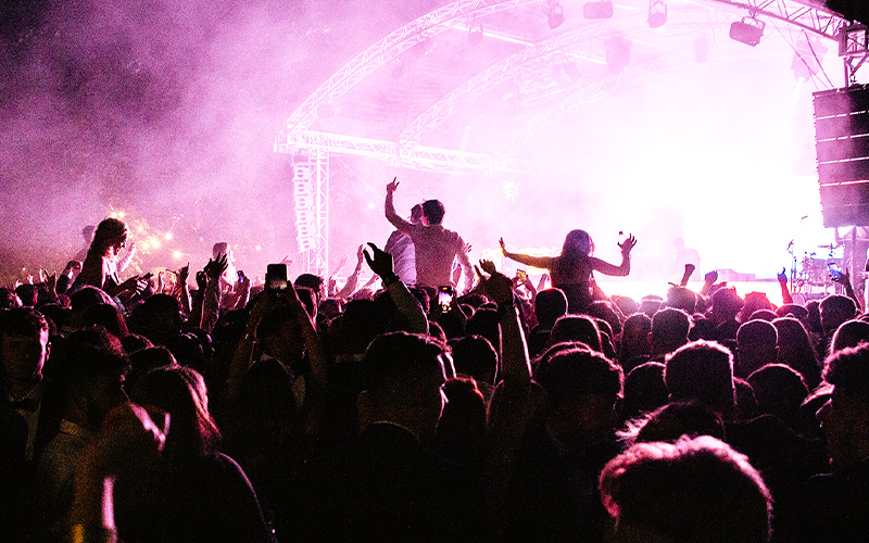 a photo of a crowd and a stage at grad ball