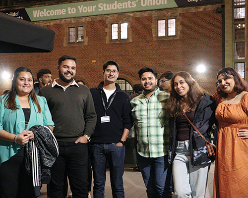 a group of students smiling in mermaid square